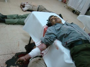 Abbas Garmabi, Hanif's father, shot in the head while lying wounded on a hospital bed in Ashraf's clinic